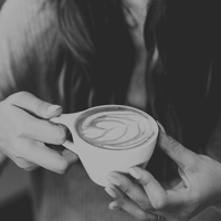 Woman holding a latte