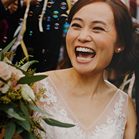 Woman smiling on her wedding day showing white, straight teeth
