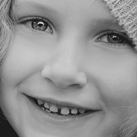 Girl smiling showing healthy teeth